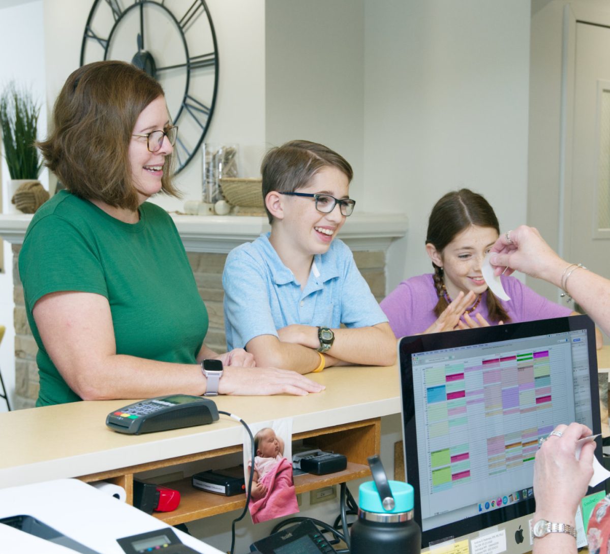 Family visiting Andrew Pedersen Orthodontics for free consultation